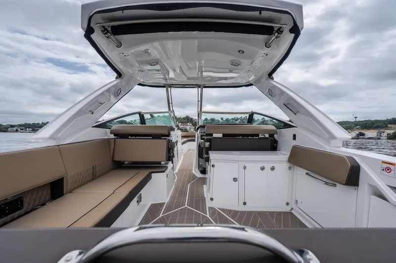 Slide: The Image of 2025 Monterey 385SS Super Sport boat interior with luxurious seating and sleek design. - 9