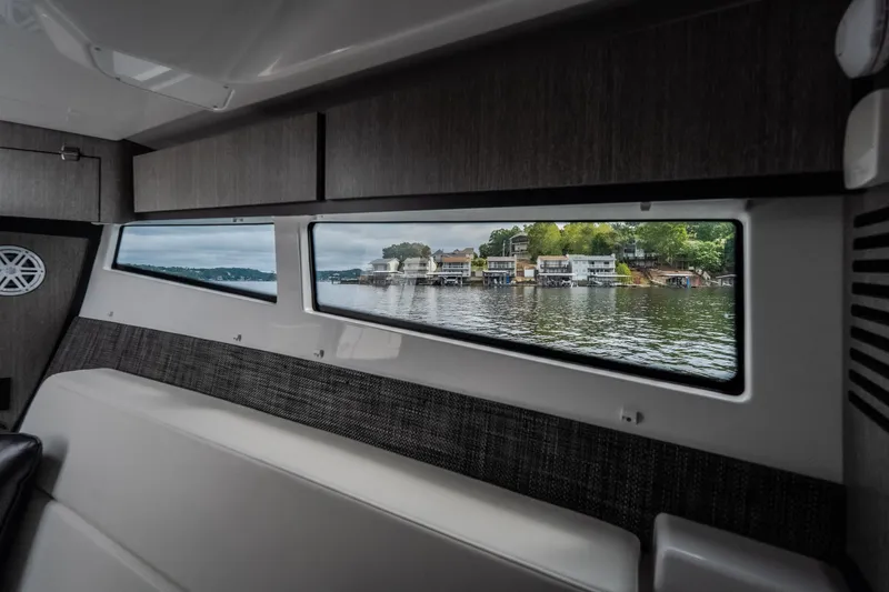 Slide: The Image of Interior view of 2025 Monterey 385SS Super Sport boat with scenic window view. - 28