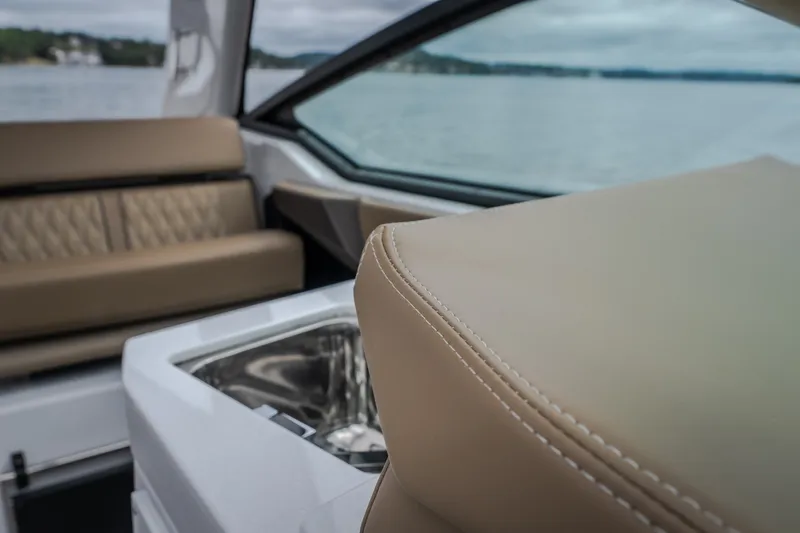 Slide: The Image of Interior of 2025 Monterey 385SS Super Sport boat with luxurious seating and sleek design. - 52