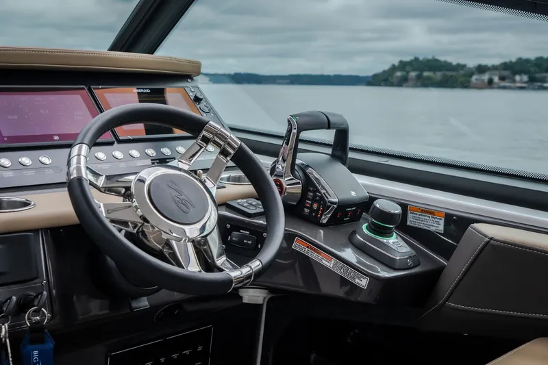 Slide: The Image of 2025 Monterey 385SS Super Sport boat cockpit with advanced controls and steering wheel. - 18