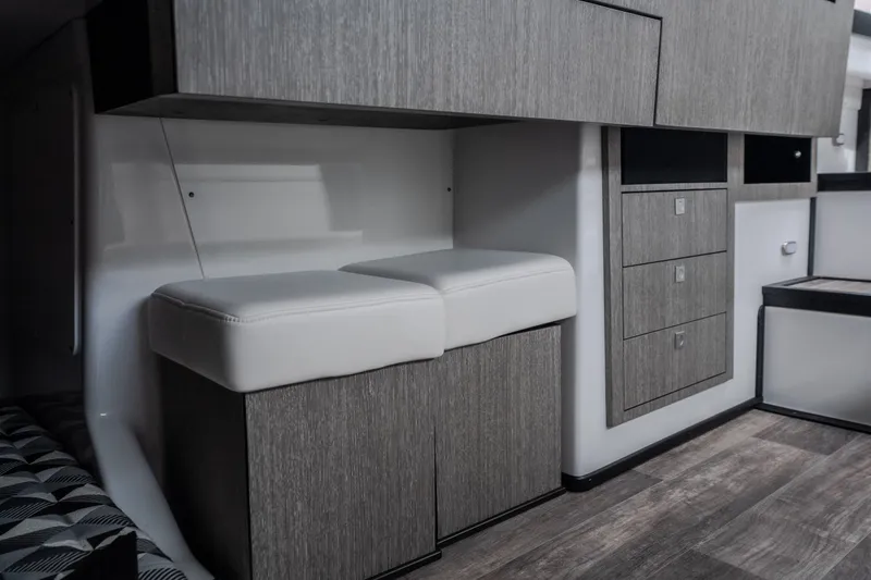 Slide: The Image of Interior of 2025 Monterey 385SS Super Sport boat with modern cabinetry and seating. - 30