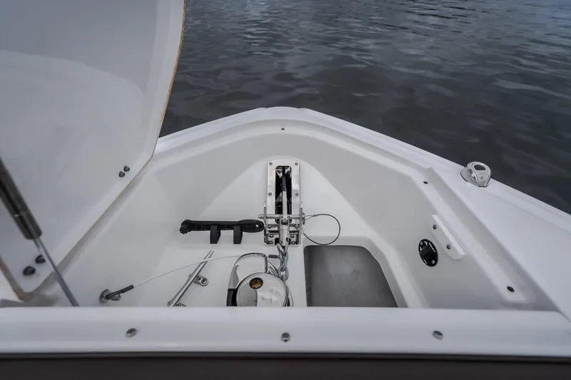 Slide: The Image of Bow storage compartment of 2025 Monterey 385SS Super Sport boat on water. - 44