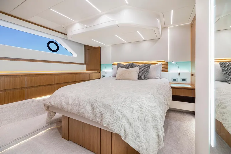 Slide: The Image of Manufacturer Provided Image: Luxurious bedroom interior of 2025 Tiara Yachts EX 54 with modern design and elegant lighting. - 53