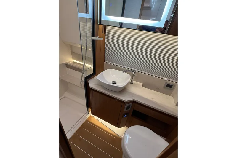 Slide: The Image of Luxurious bathroom in 2026 Tiara Yachts EX 54, featuring modern fixtures and elegant design. - 33