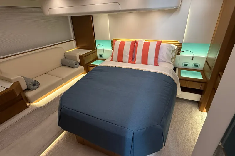 Slide: The Image of Luxurious 2026 Tiara Yachts EX 54 bedroom with elegant bedding and ambient lighting. - 29