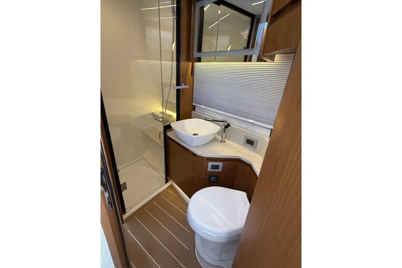 Slide: The Image of Luxurious bathroom in 2026 Tiara Yachts EX 54, featuring modern fixtures and elegant design. - 27