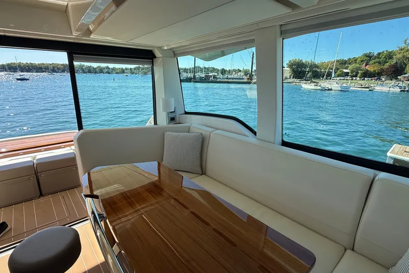 Slide: The Image of Luxurious interior of 2026 Tiara Yachts EX 54 with scenic water view. - 14