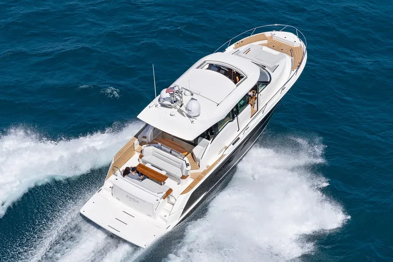 Slide: The Image of Manufacturer Provided Image: 2025 Tiara Yachts EX 54 cruising on open water, aerial view. - 25