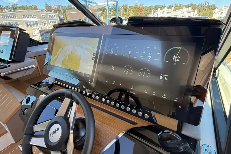 Slide: The Image of Dashboard of 2026 Tiara Yachts EX 54 with advanced navigation and control systems. - 18