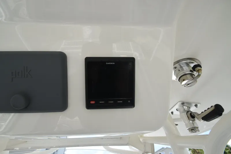 Slide: The Image of The image shows a Garmin navigation system and a Polk speaker enclosure on a boat. - 11