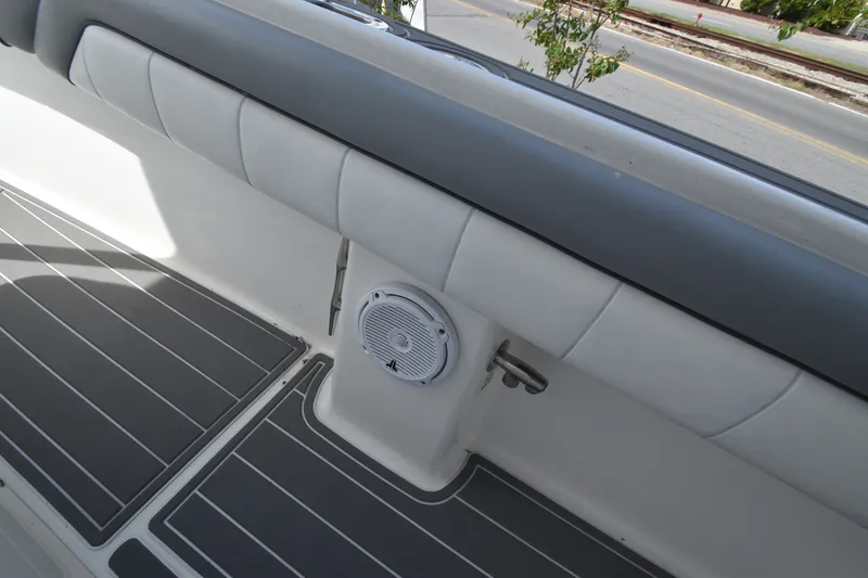 Slide: The Image of The image shows a boat's cushioned seating area with a built-in speaker. - 14