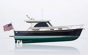 Slide: The Image of Side view of a 2003 Legacy 34 Express with a US flag at the stern. - 42
