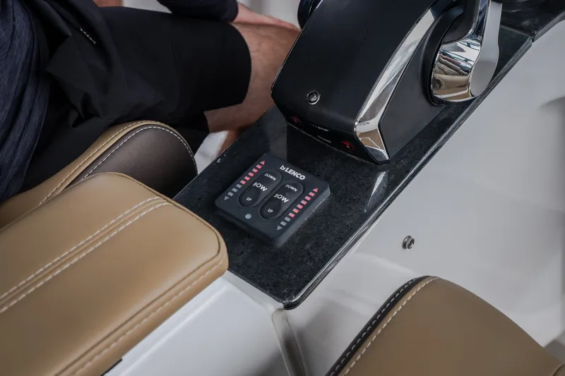 Slide: The Image of Control panel of 2026 Monterey Elite 30 OB boat with leather seating. - 61