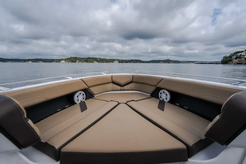 Slide: The Image of Luxurious seating on the 2026 Monterey Elite 30 OB boat, overlooking serene waters. - 30