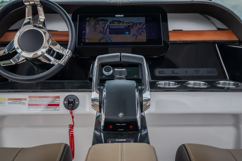 Slide: The Image of 2026 Monterey Elite 30 OB dashboard with steering wheel, touchscreen, and controls. - 16