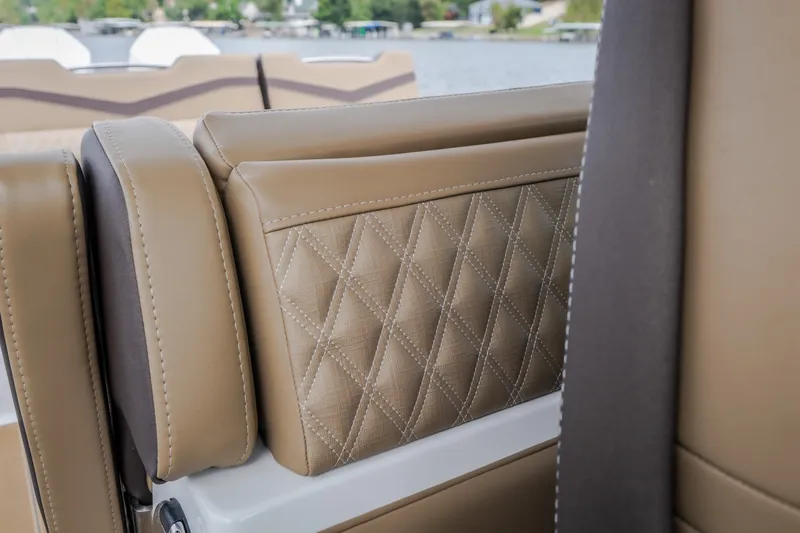 Slide: The Image of Luxurious tan leather seating on 2026 Monterey Elite 30 OB boat, featuring diamond stitching. - 25