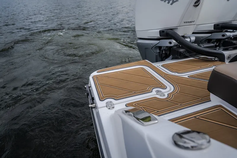 Slide: The Image of 2026 Monterey Elite 30 OB boat with sleek deck design and powerful engine on water. - 50