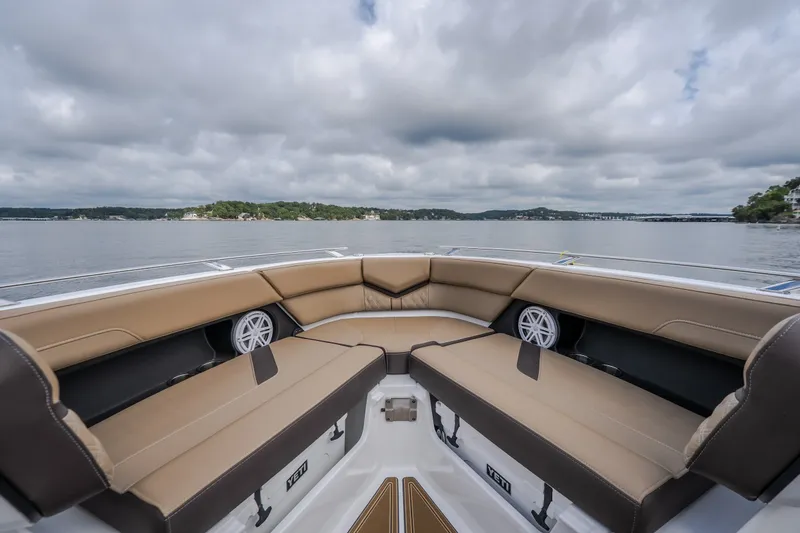 Slide: The Image of Luxurious seating on 2026 Monterey Elite 30 OB boat with scenic lake view. - 31