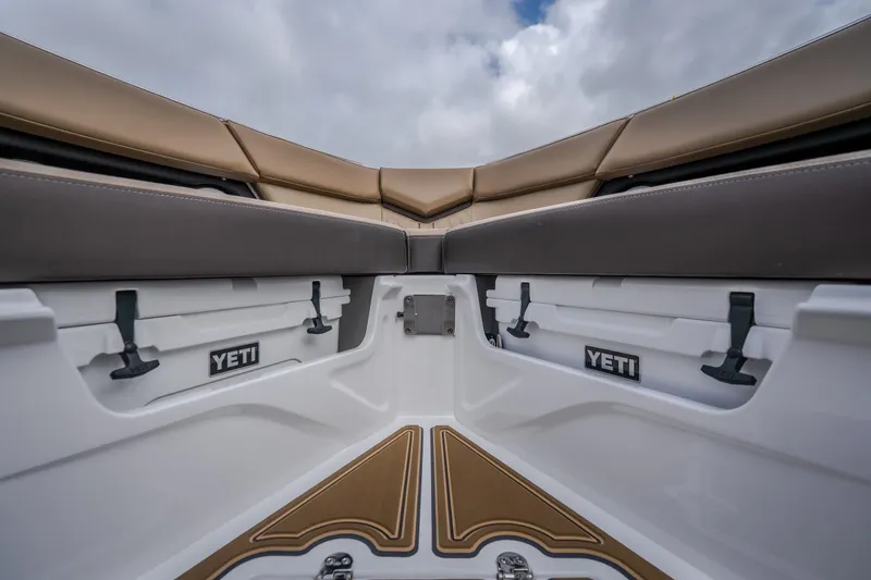 Slide: The Image of Interior view of 2026 Monterey Elite 30 OB boat with Yeti coolers. - 32
