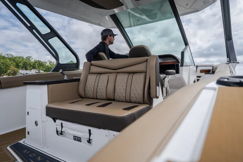 Slide: The Image of 2026 Monterey Elite 30 OB boat interior with luxurious seating and modern design. - 9