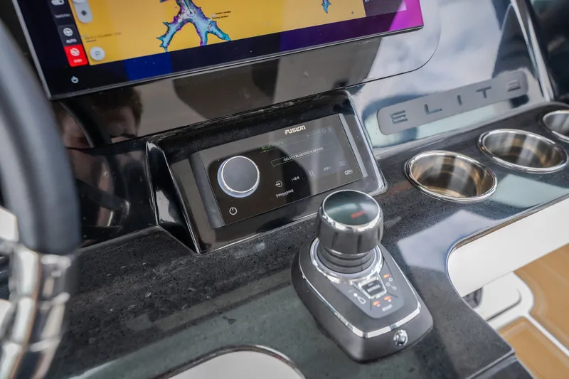 Slide: The Image of 2026 Monterey Elite 30 OB dashboard with navigation screen and control panel. - 18