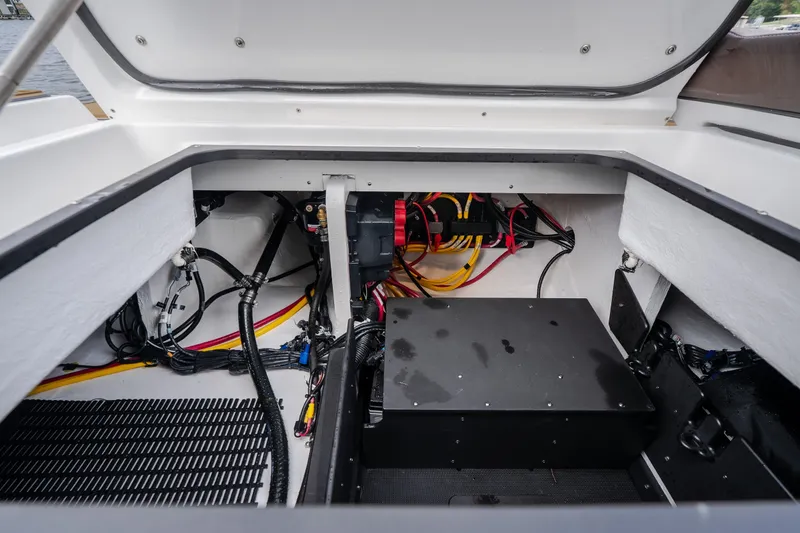 Slide: The Image of Engine compartment of 2026 Monterey Elite 30 OB boat, showcasing wiring and components. - 48