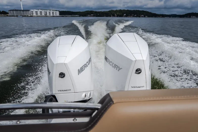 Slide: The Image of 2026 Monterey Elite 30 OB with dual Mercury Verado engines cruising on a lake. - 55