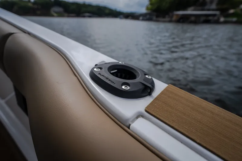 Slide: The Image of Close-up of 2026 Monterey Elite 30 OB boat detail by the water. - 57