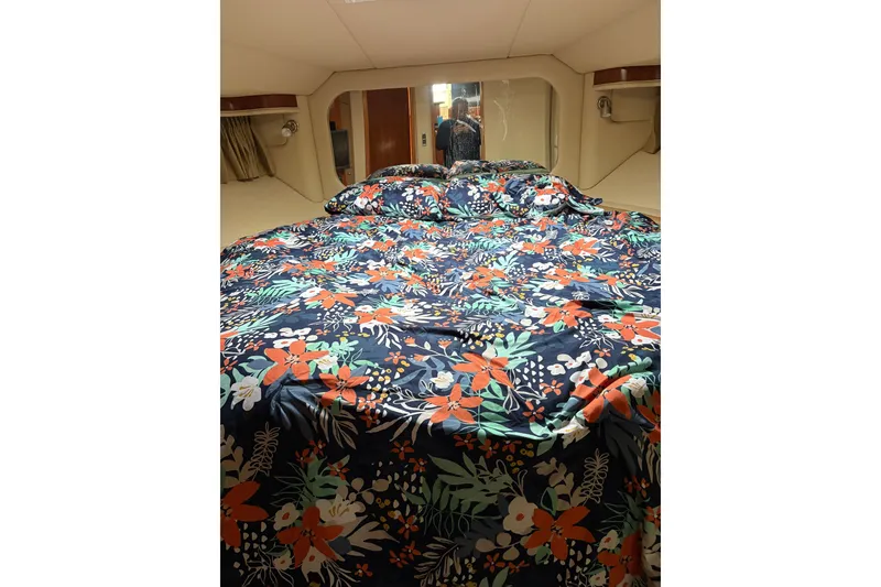 Slide: The Image of Luxurious 2005 Sea Ray 480 Motor Yacht bedroom with floral bedding. - 10