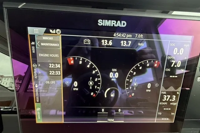 Slide: The Image of Simrad display on 2025 Axopar 37 XC Cross Cabin showing engine metrics and navigation data. - 20