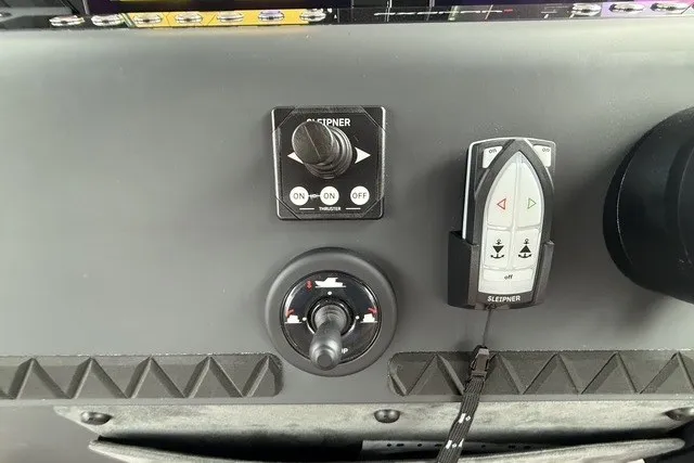 Slide: The Image of Control panel of 2025 Axopar 37 XC Cross Cabin with joystick and remote. - 21