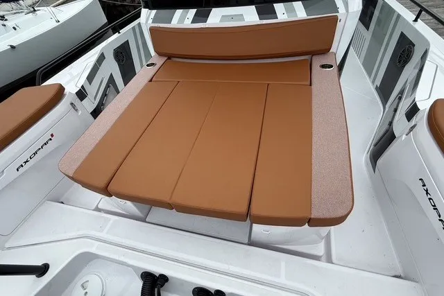 Slide: The Image of 2025 Axopar 37 XC Cross Cabin with tan seating and sleek design. - 15