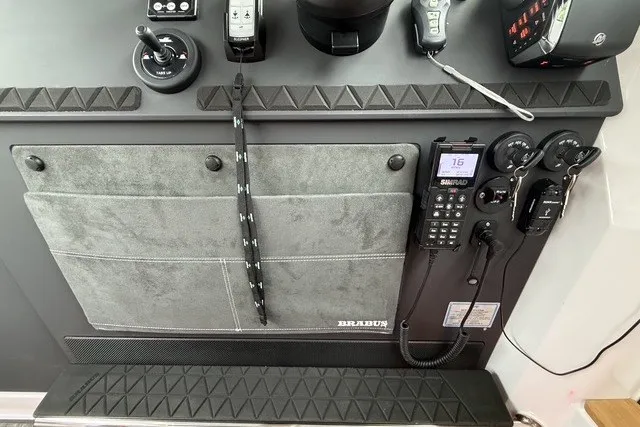 Slide: The Image of Control panel of 2025 Axopar 37 XC Cross Cabin with navigation equipment and controls. - 22
