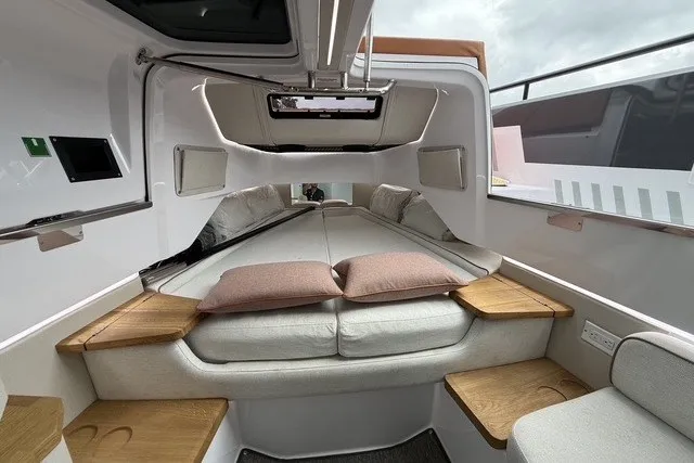 Slide: The Image of 2025 Axopar 37 XC Cross Cabin interior with cozy sleeping area and modern design. - 29