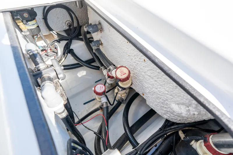 Slide: The Image of 2013 Yellowfin 24 Bay boat interior showing fuel system and wiring components. - 15