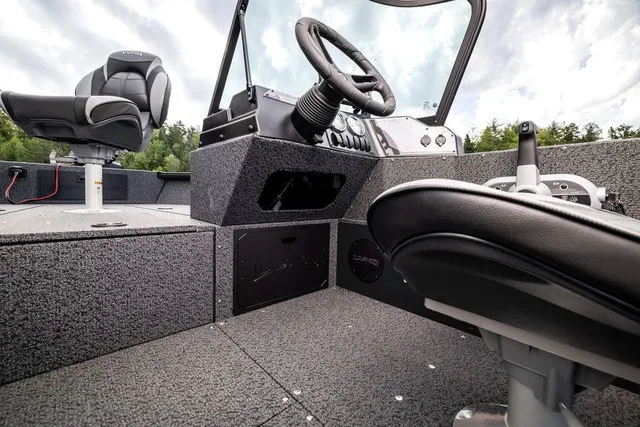 Slide: The Image of The image shows the cockpit of a Lund 1700 Adventure Sport boat with modern seating and controls. - 13