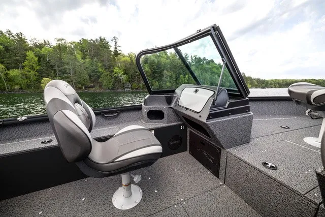 Slide: The Image of The image shows the cockpit of a 2027 Lund 1700 Adventure Sport boat with gray seats. - 10