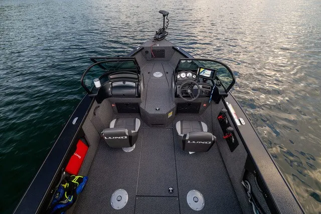 Slide: The Image of The image shows a modern boat with two seats and a helm on calm water. - 1