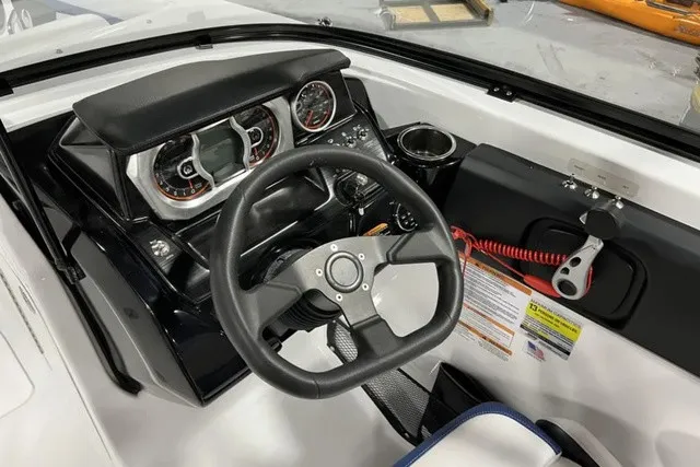 Slide: The Image of The image shows the cockpit of a 2025 Scarab 255 LX with a modern dashboard. - 20