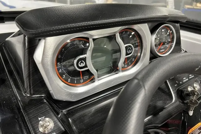 Slide: The Image of The image shows the dashboard of a 2025 Scarab 255 LX with modern gauges. - 21
