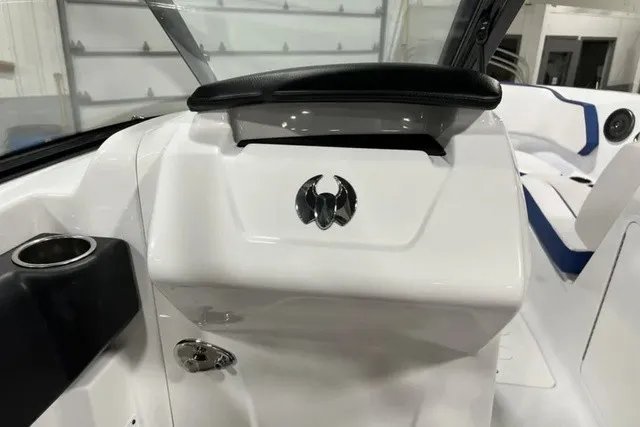 Slide: The Image of The image shows the cockpit of a 2025 Scarab 255 LX boat with modern controls. - 17