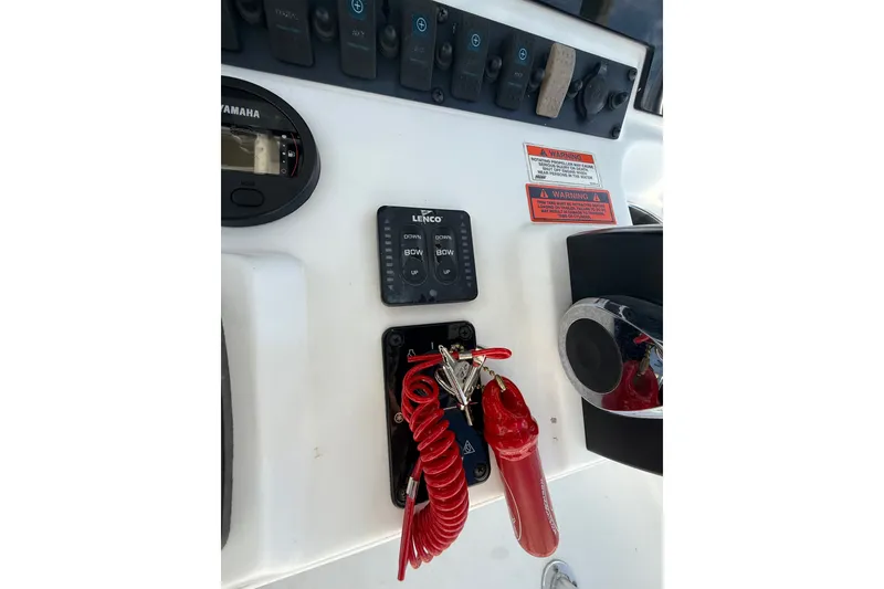 Slide: The Image of Control panel of 2018 Sea Hunt Ultra 211 boat with switches and safety features. - 15