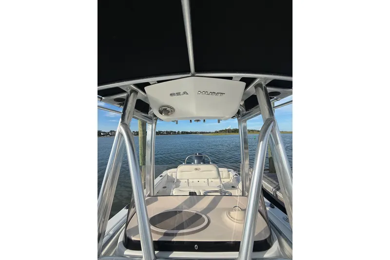 Slide: The Image of 2018 Sea Hunt Ultra 211 boat interior with water view and sturdy framework. - 16