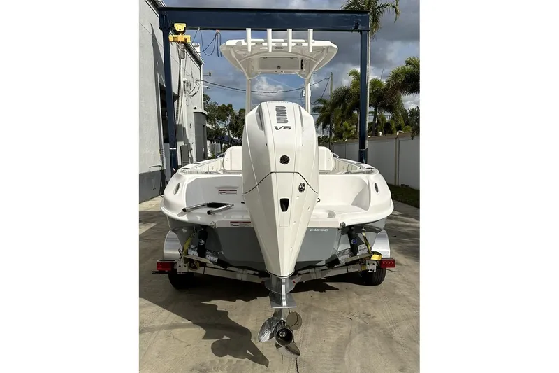 Slide: The Image of 2025 Glassream 240 CCX boat with V8 engine, parked on a trailer. - 10