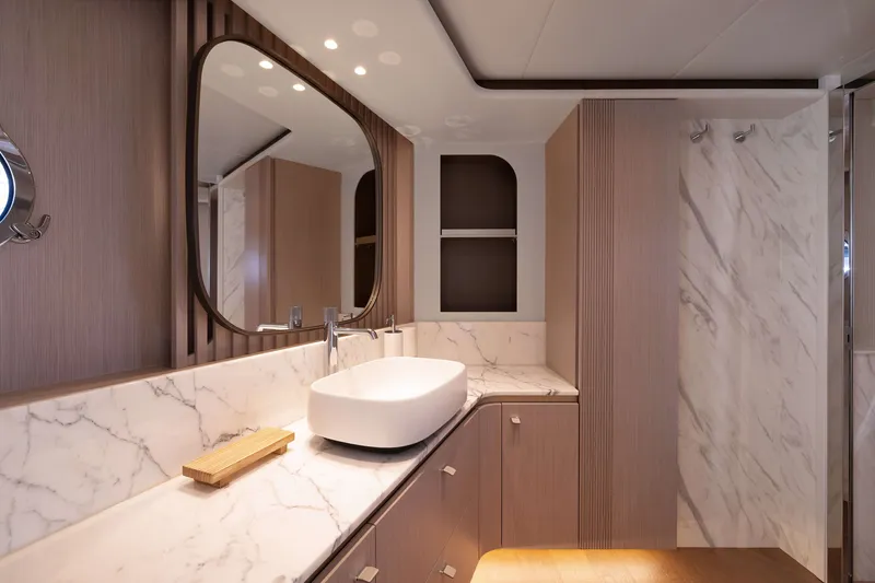 Slide: The Image of Luxurious bathroom interior of 2027 Absolute Navetta 62 yacht with marble accents. - 34