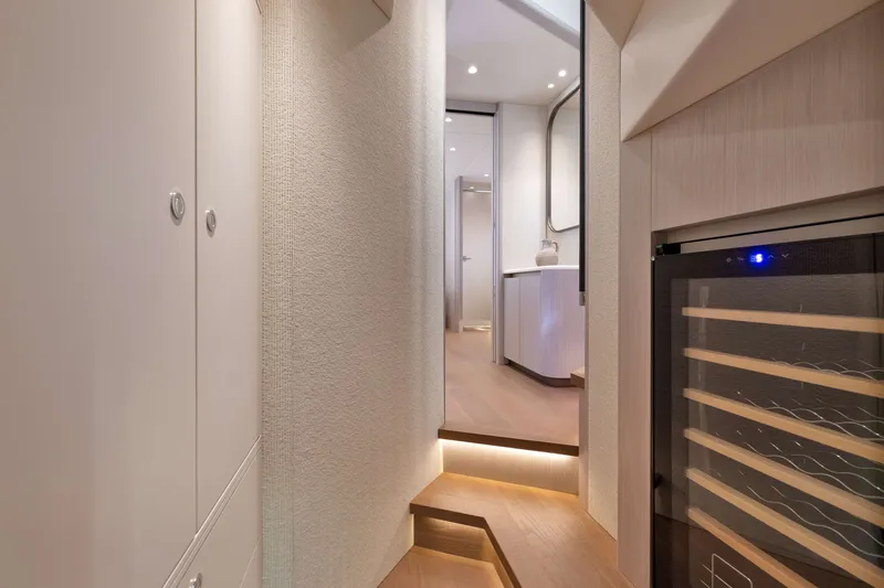 Slide: The Image of Luxurious interior of 2027 Absolute Navetta 62 yacht with modern design and ambient lighting. - 41