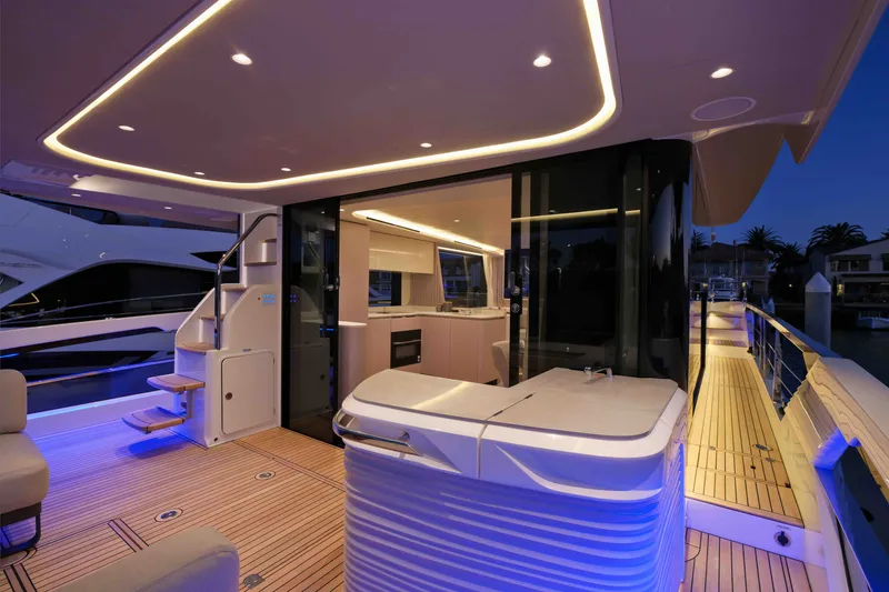 Slide: The Image of Luxurious 2027 Absolute Navetta 62 yacht interior with modern lighting and sleek design. - 28