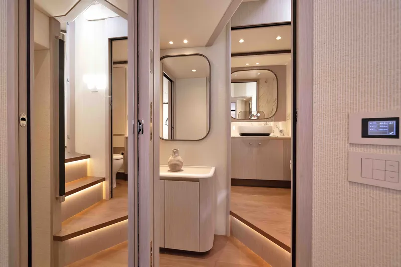 Slide: The Image of Luxurious interior of 2027 Absolute Navetta 62 yacht with modern design and ambient lighting. - 39