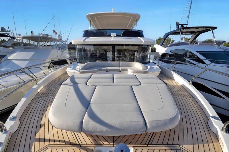 Slide: The Image of Luxurious 2027 Absolute Navetta 62 yacht with spacious deck and modern design. - 57