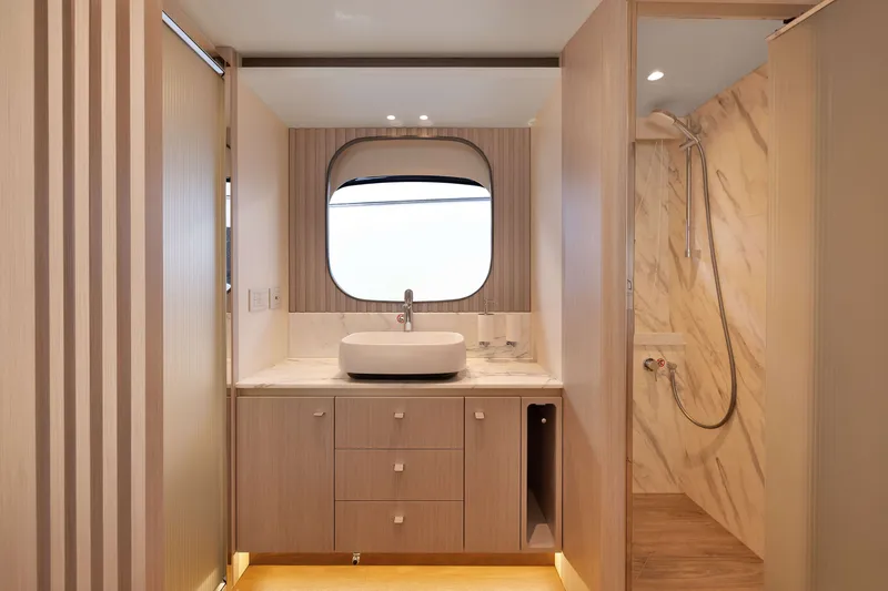 Slide: The Image of Luxurious bathroom interior of 2027 Absolute Navetta 62 yacht with modern fixtures and elegant design. - 47